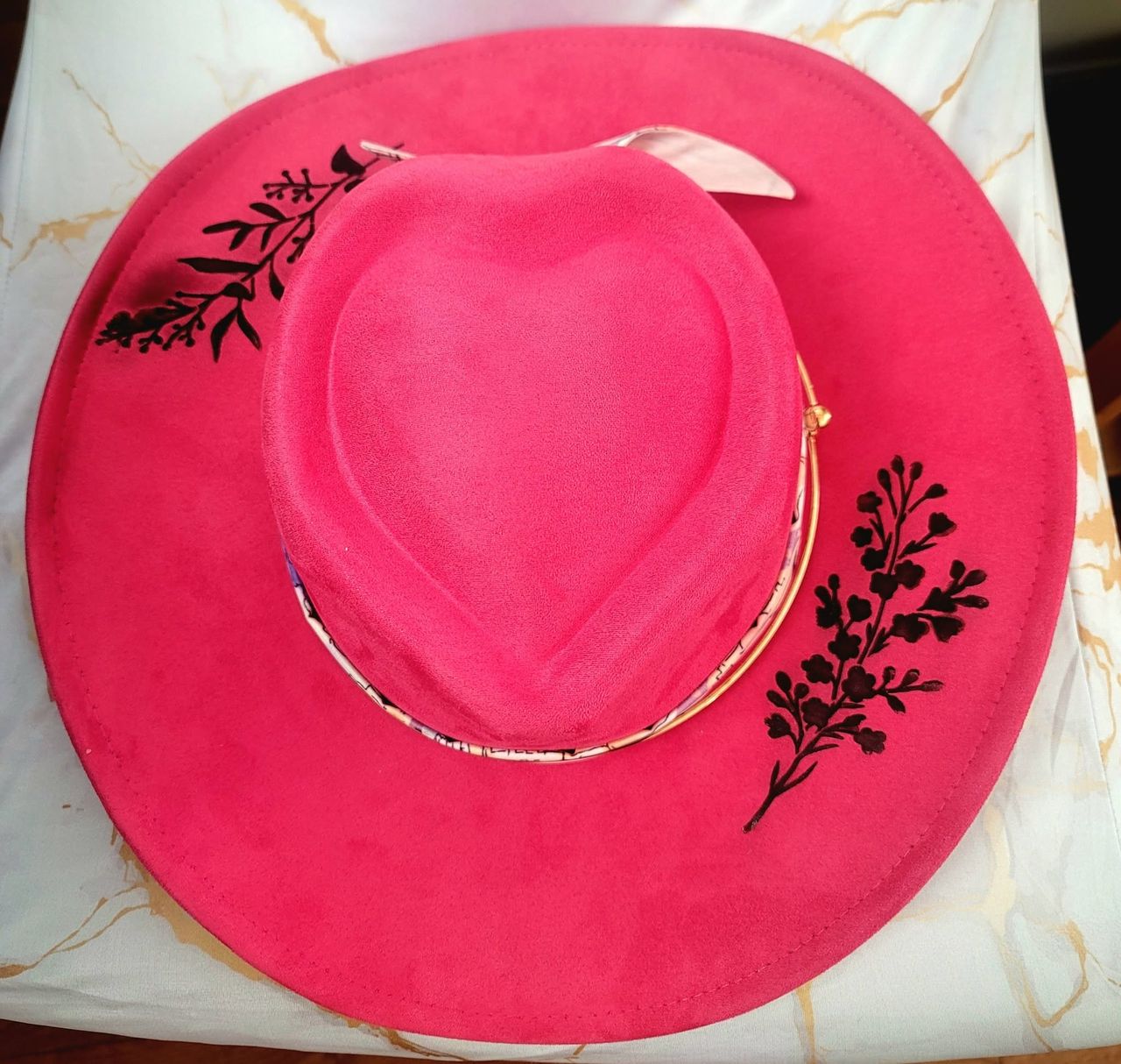 Top view of the Sweetheart — pink suede hat with heart-shaped crown